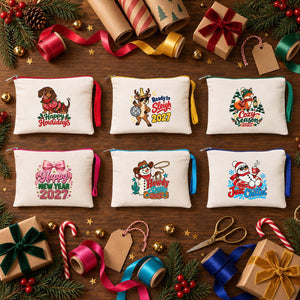 Six printed cotton zipper pouches with Happy Howlidays, Ready to Sleigh, Cozy Season, Happy New Year, Howdy Snow and Just Chillin prints on a Christmas gift-wrapping table