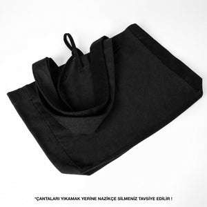 Opgevouwen zwarte gabardine draagtas met trekkoord - Pamusan.nl
