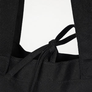 Detail van het trekkoord en de handvatten van een zwarte gabardine draagtas - Pamusan.nl