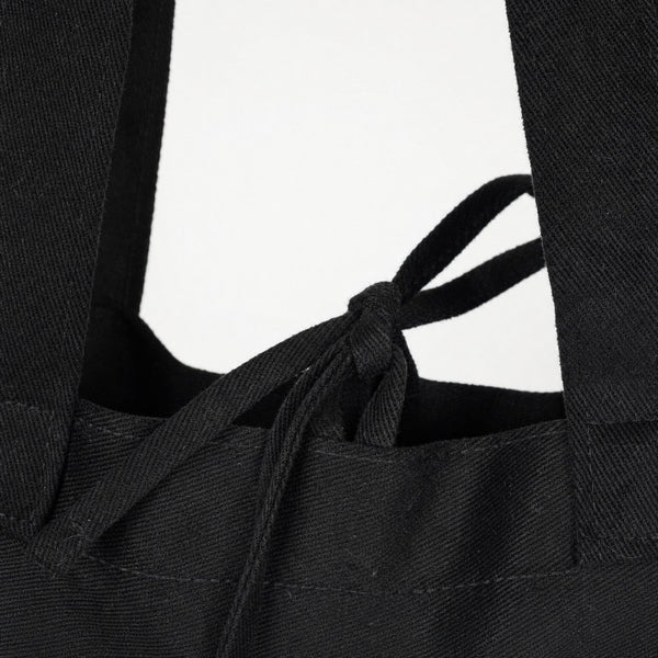 Detail van het trekkoord en de handvatten van een zwarte gabardine draagtas - Pamusan.nl