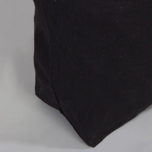 Black fabric corner on a gray background