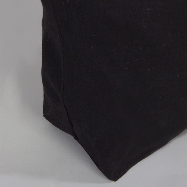 Black fabric corner on a gray background