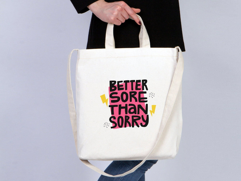 Beige tote bag with customizable text on a neutral background
