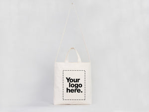 White tote bag with 'Your logo here.' text on a light gray background