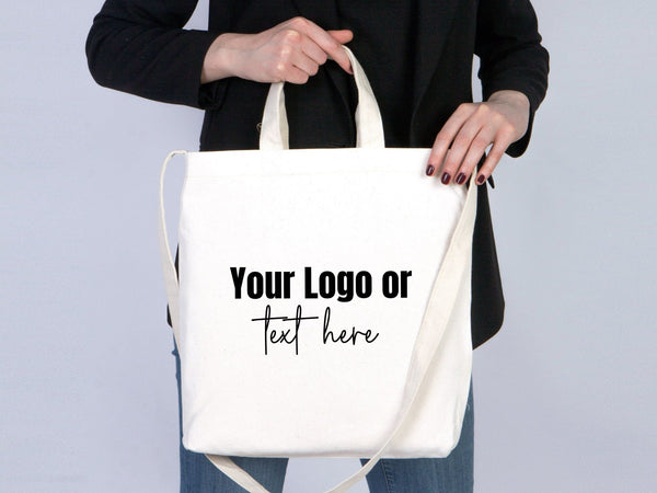 White tote bag with customizable text on a plain background