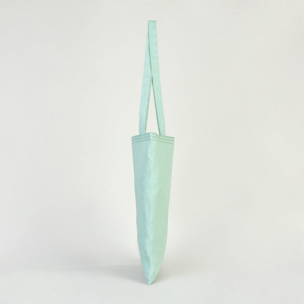 Light blue tote bag on a white background