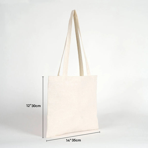 Beige tote bag with measurements on a white background