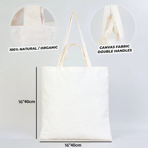 White tote bag with text indicating natural/organic material and canvas fabric, on a light gray background.
