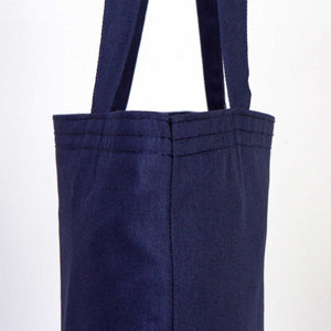 Navy blue tote bag with straps on a white background