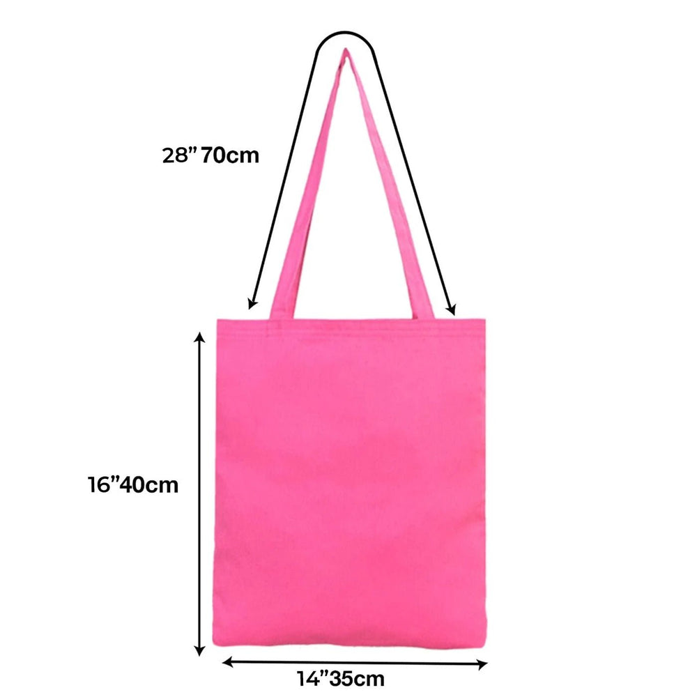 Pink tote bag held by a person with dimensions displayed