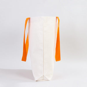 White bag with orange straps on a light gray background