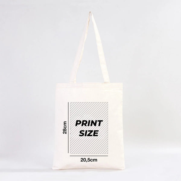 White tote bag with print size measurement details on a light gray background