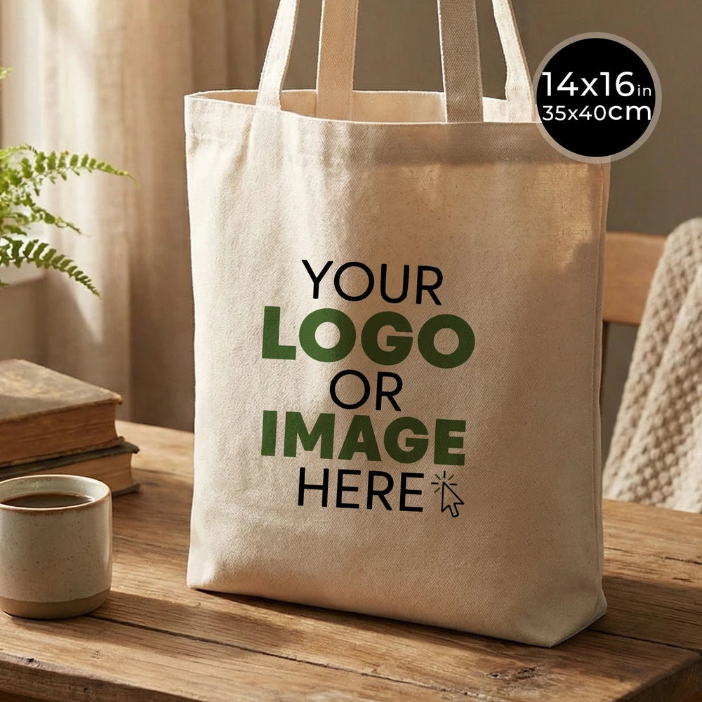 Beige tote bag with customizable text on a wooden surface with a plant and books in the background