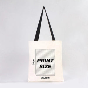 Tote bag with print size information on a light gray background