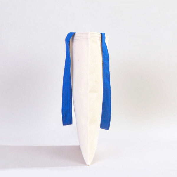 White surfboard with blue fins on a white background