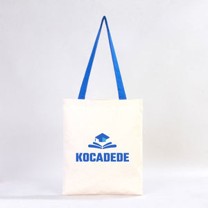 White tote bag with blue handle and 'KOCADEDE' logo on a white background