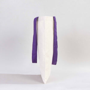 White ceramic vase with purple accents on a light gray background