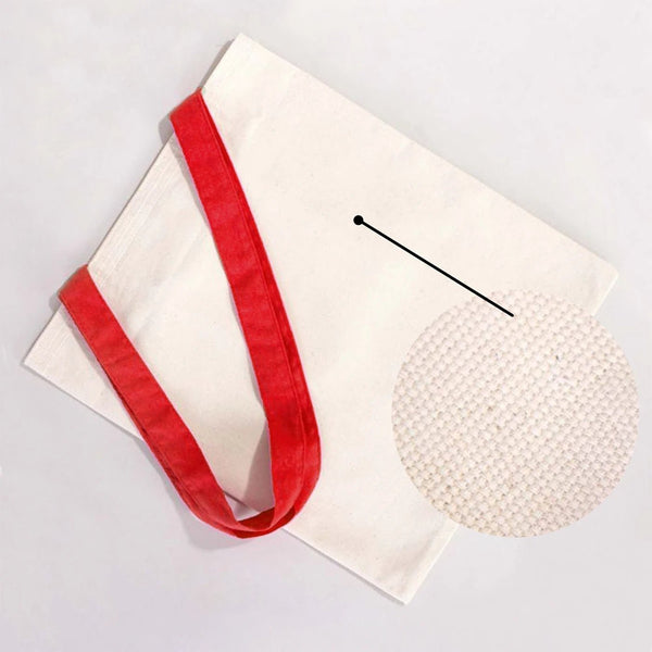 Beige clutch bag with red handle on a light gray background