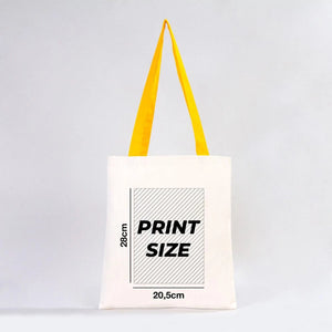 Tote bag with yellow straps and print size information on a white background