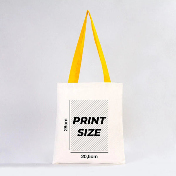 Tote bag with yellow straps and print size information on a white background