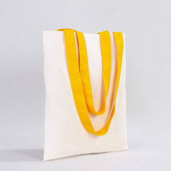 White tote bag with yellow handles on a light gray background