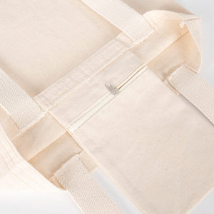 Close-up of a beige woven fabric with a white background