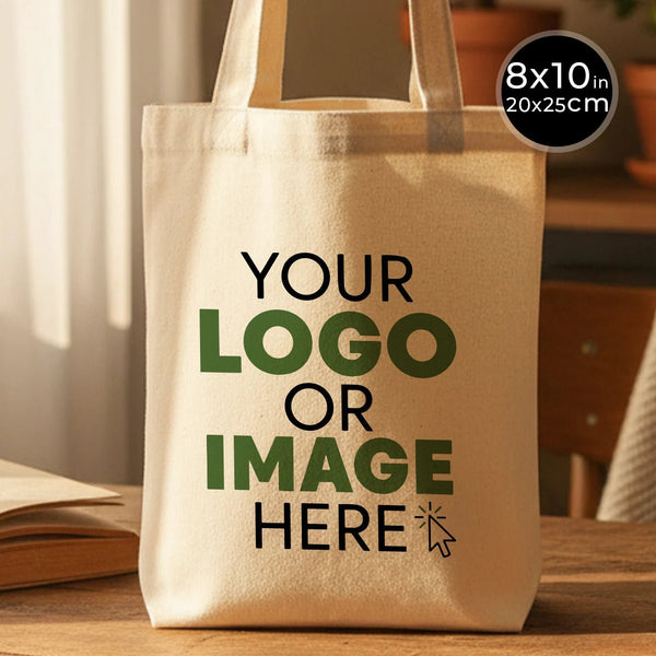 Beige tote bag with customizable text on a wooden surface