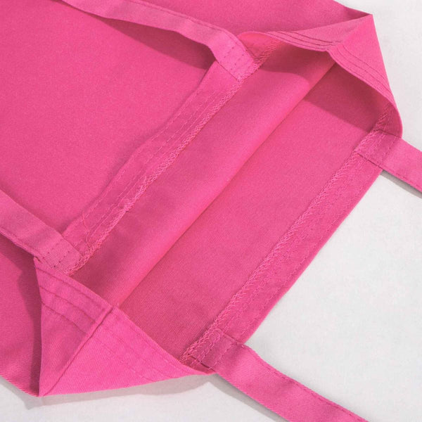 Close-up of a pink apron on a white background