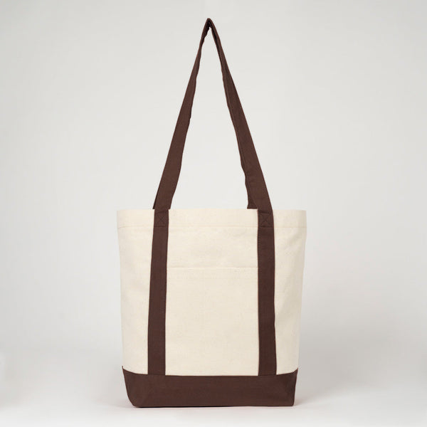 Hangend vooraanzicht van de canvas tas met donkerbruine hengsels - Pamusan.nl