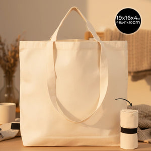 Beige tote bag on a wooden surface with dimensions displayed