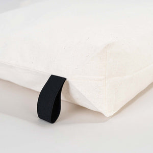 Black elastic band on a white fabric background