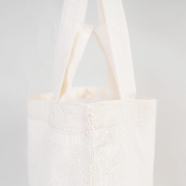 White tote bag on a light gray background