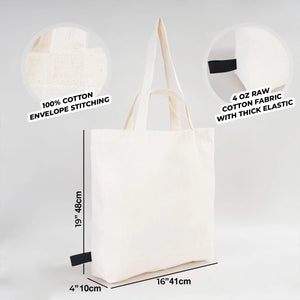 White tote bag with text labels on fabric and stitching details, and dimensions displayed.