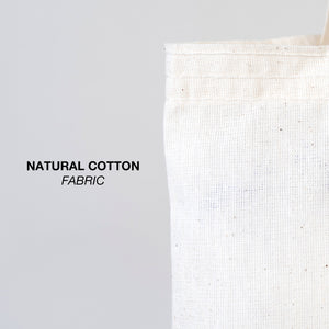 Close-up of natural cotton fabric with text 'NATURAL COTTON FABRIC' on a gray background