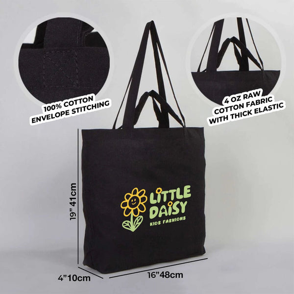 Black tote bag with 'Little Daisy' branding and measurements on a gray background