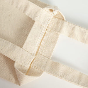 Close-up of beige fabric with a white background