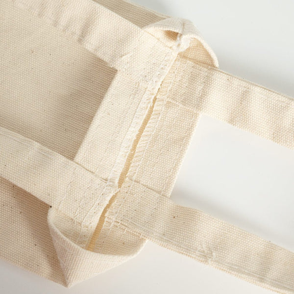 Close-up of beige fabric with a white background