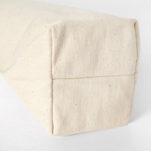 Close-up of a beige fabric texture on a white background