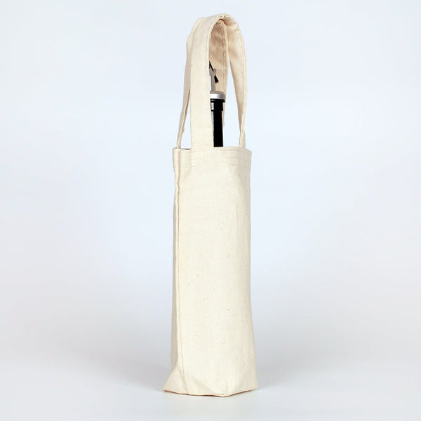 Beige tote bag with a pen inside on a white background